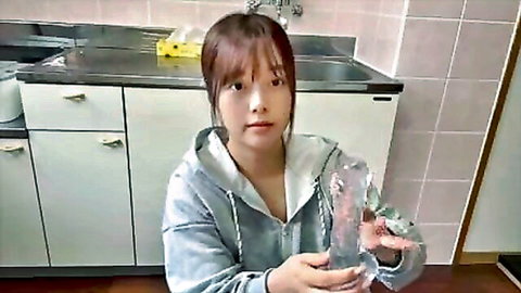 Japanese college girl in hoodie holds clear dildo, unwashed pussy tease