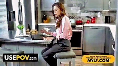 Busty MILF stepmom working on laptop in pink blouse