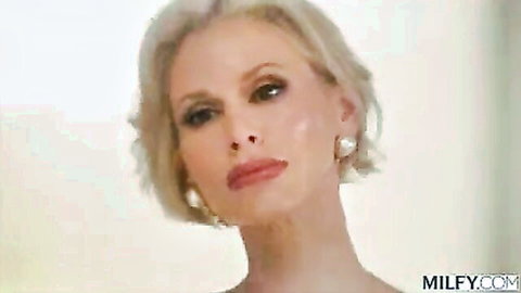Busty blonde MILF Casca Akashova close-up seductive portrait