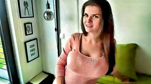 YooYa7 brunette with massive cleavage in tight pink sweater, smiling tease