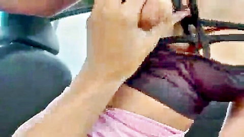 Man's hand pulling down purple panties exposing shaved wet pussy in car backseat