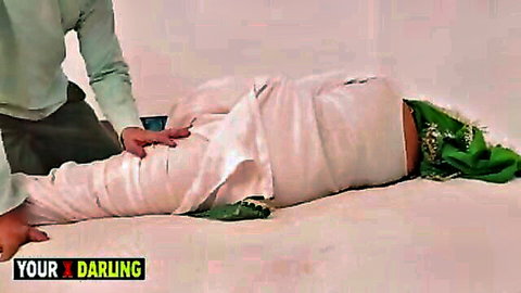Indian stepmom wrapped in white fabric, surprised by stepson touch