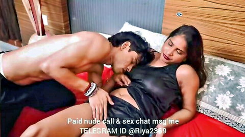 Indian couple in intimate foreplay, man kissing exposed breasts in hot web series