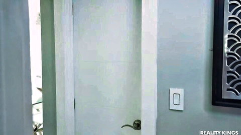 Luna Star teases at open door in sultry indoor scene