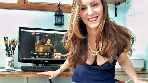 Goddess Vikki Lynn smiles in low-cut top while watching gay porn together