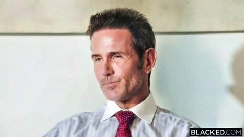 Businessman in suit dominating hotwife Cherry Kiss in intense scene