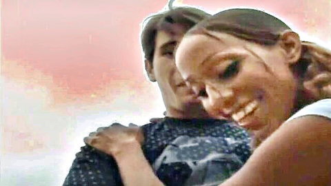 Smiling ebony babe embraced tightly by white stud in passionate interracial hug