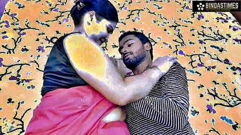 Indian stepmom in pink saree hugs stepson intimately on bed