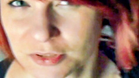 Seductive redhead MILF close-up with glossy plump lips parted teasing cock sucking