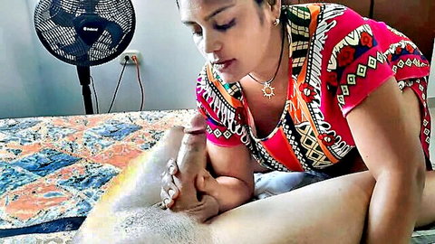 Curvy mature Latina MILF grips thick veiny erect cock with hand in homemade bedroom