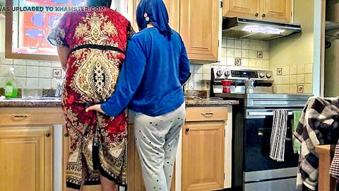 SouzanHalabi in Arab lesbian couple tease, hand on ass in kitchen