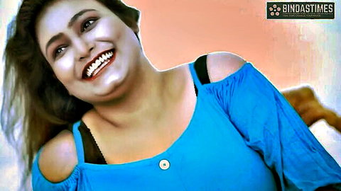 Sucharita smiling seductively in blue off-shoulder top