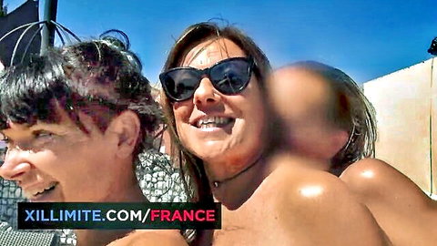 Caro La Petite Bombe topless with friends at French swinger club, sunny outdoor laughs