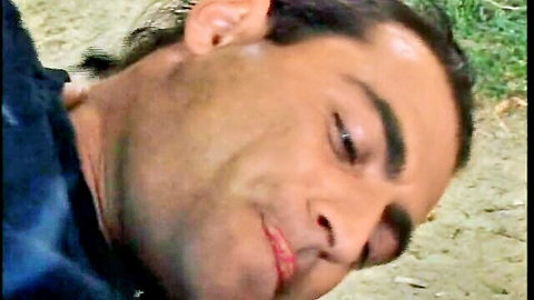 Closeup of handsome young Italian brunette man's ecstatic pleasure face with parted lips during intense orgasm