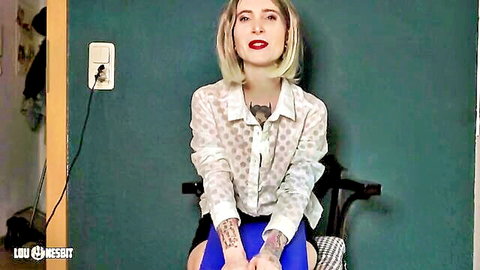 Blonde mistress in sheer blouse spreads legs teasing panties on cam