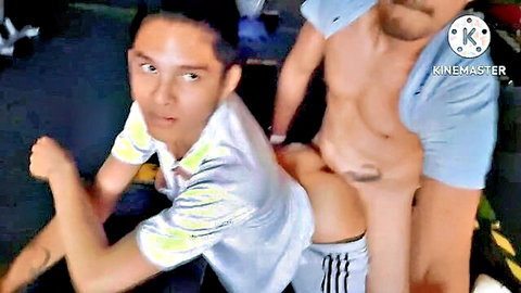 Skinny young twink in white shirt and socks bent over doggy style taking muscular hunk's cock anally