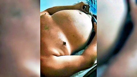 Man's massive pale belly with deep protruding navel exposed, blue shorts pulled aside teasingly