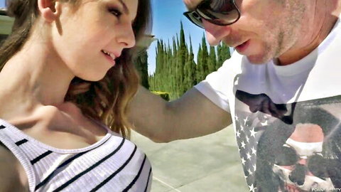 Curvy brunette with big tits in striped top smiles at sunglasses guy outdoors