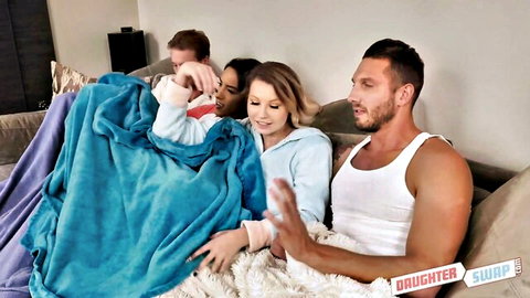 Cara May and Adrian Hush in cozy Daughter Swap blanket scene with friends