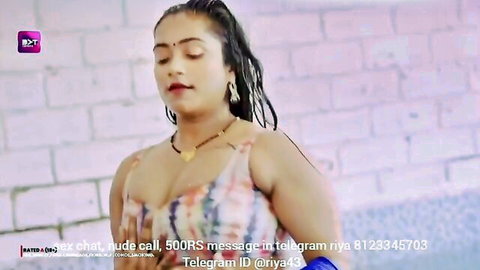 Wet Indian woman in clinging colorful top, curvy figure and ponytail