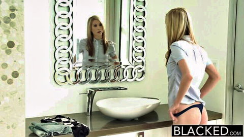 Blonde babe pulls down black panties exposing bare juicy ass in bathroom mirror