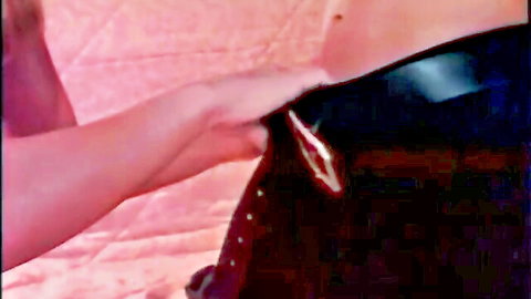 Hand unzipping tight black pants on curvy ebony woman's hips teasing pussy reveal