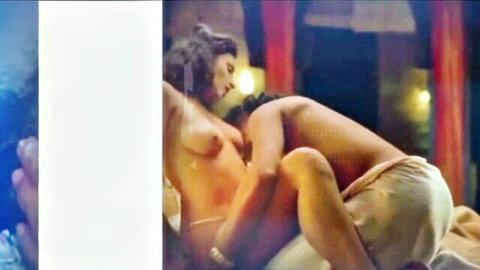 Topless South Asian brunette with perky tits passionately mounted missionary by muscular man in lingerie