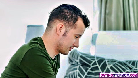 Handsome stepson in green shirt on bed, from Zlata Shine's Russian MILF creampie scene