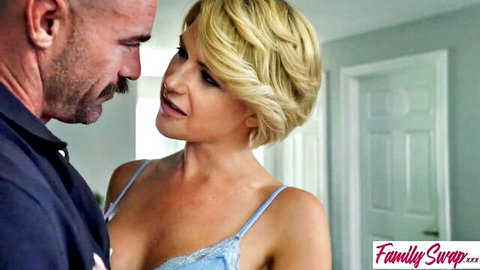 Blonde woman in blue lingerie shares intimate moment with bearded man
