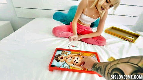 Blonde Jessie Saint in crop top and pink pants playing sexy Operation game