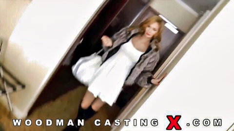 Kery Miller in white dress and fur jacket entering Woodman Casting X