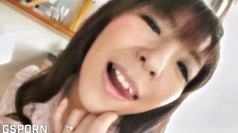Smiling Japanese young MILF in pink top, seductive close-up selfie