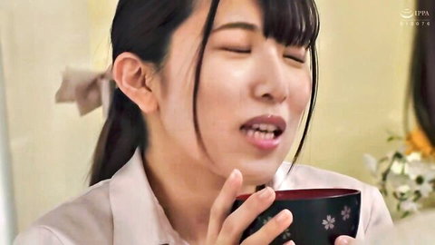 Japanese MILF with long black hair sipping from bowl in blouse, censored JAV