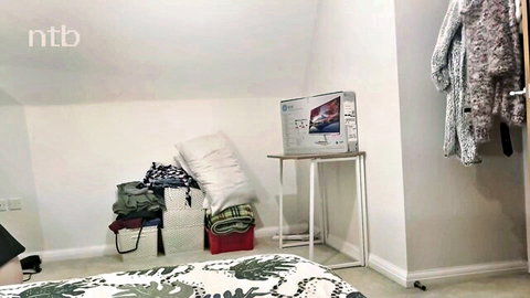 Husband watching wife in messy bedroom setup