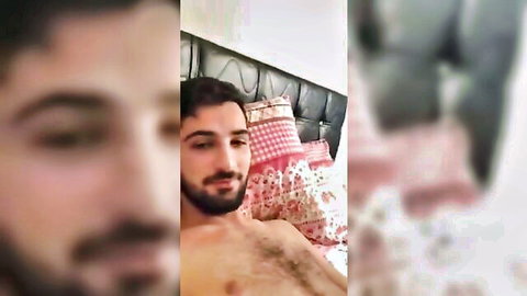 Handsome Turkish bearded man shirtless on bed, amateur solo pose