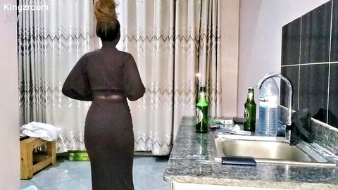 Curvy ebony woman in tight maroon dress, ponytail, sexy rear view