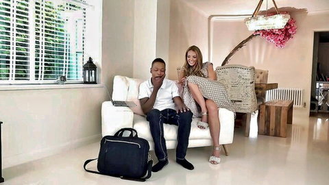 Blonde British slag teasing black man's massive cock on couch