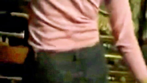 Arab woman dancing in pink top and dark pants, sexy solo performance