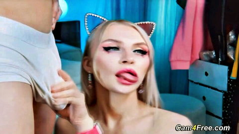 Blonde cat-eared babe in pink sleeves giving blowjob to lover
