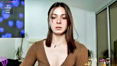 Sindi Croford MyFreeCams webcam tease in low-cut brown sweater cleavage