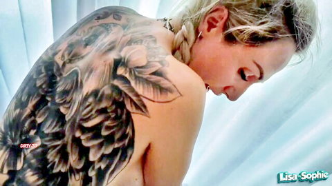 Lisa-Sophie blonde tattooed back view, nude with choker collar