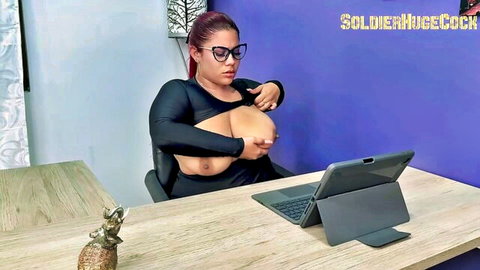 Busty Latina redhead in black bodysuit exposing huge tits at desk
