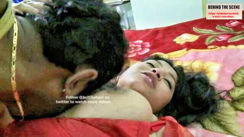 Man passionately kissing curvy Bangladeshi woman's neck in bed foreplay