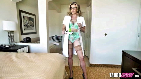 Blonde MILF doctor in open white coat revealing green lingerie bra panties garter stockings and heels holding clipboard