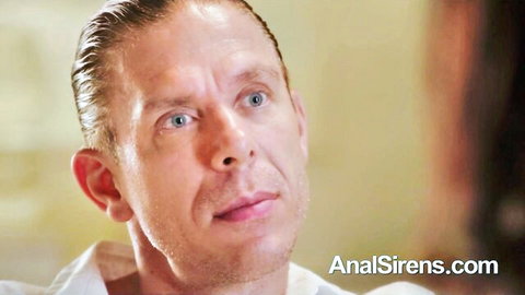 Close-up of handsome blue-eyed Caucasian man in white shirt from AnalSirens anal porn