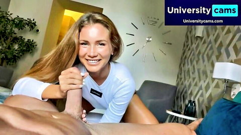 Blonde babe smiling while gripping thick cock in amateur webcam handjob