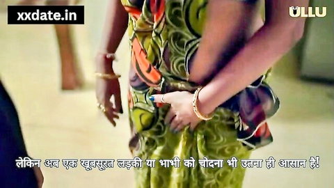 Desi Indian bhabhi in green saree posing seductively on ULLU series