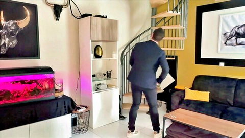 Amateur man in suit standing in stylish room for Jacquie Et Michel TV