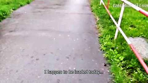 Outdoor paved path with green grass barriers and CzechHunter watermark text 'I happen to be loaded today'