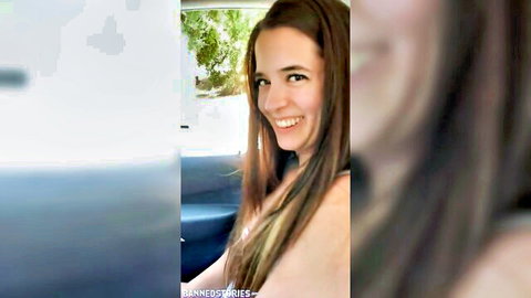 Abbie Maley smiles with cleavage in car, teasing brunette beauty